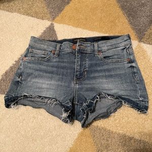 Midrise jean shorts with dye striping